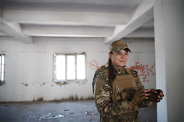 Image showing military female soldier having a break