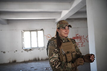 Image showing military female soldier having a break