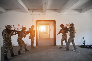 Image showing military troops in action urban environment