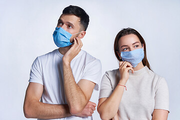 Image showing Young couple wearing medicine masks