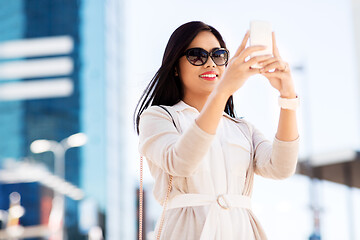 Image showing asian woman taking selfie by smartphone in city