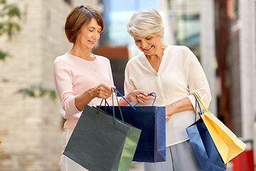 Image showing senior women with shopping bags in city