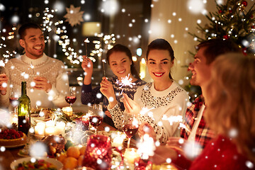 Image showing happy friends celebrating christmas at home feast