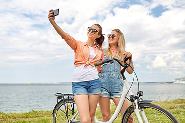 Image showing teenage girls with bicycle taking selfie in summer