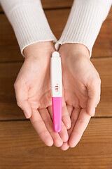 Image showing woman hands holding positive pregnancy test