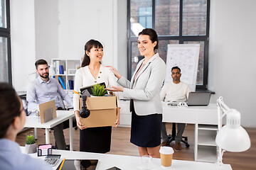 Image showing new female employee meeting colleagues at office