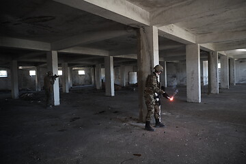 Image showing military troops in action urban environment