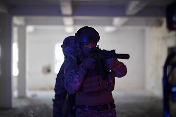 Image showing Soldiers squad in tactical formation having action urban environment