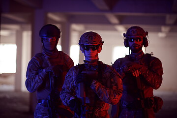 Image showing soldier squad team portrait in urban environment colored lightis