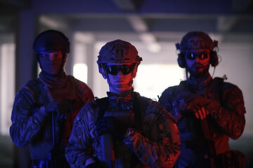 Image showing soldier squad team portrait in urban environment colored lightis