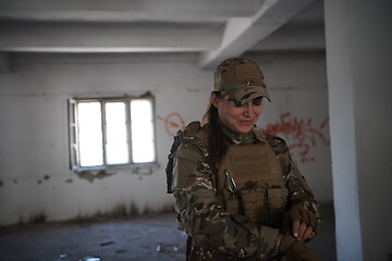 Image showing military female soldier having a break