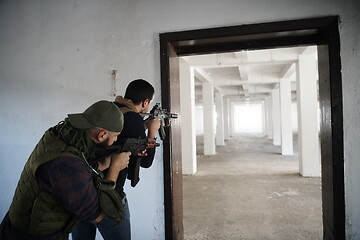 Image showing military troops in action urban environment