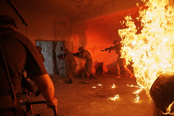 Image showing Videographer Taking Action Shoot of Soldiers in Action urban environment