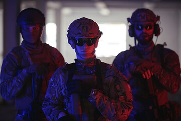 Image showing soldier squad team portrait in urban environment colored lightis