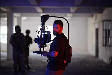 Image showing Videographer Taking Action Shoot of Soldiers in Action urban environment