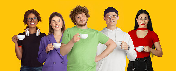 Image showing Portrait of young people on bright yellow studio background, collage