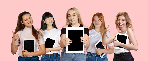 Image showing Portrait of young people on pink coral studio background, collage