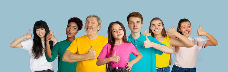 Image showing Portrait of young people on light blue studio background, collage