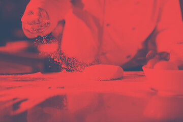 Image showing chef hands preparing dough for pizza