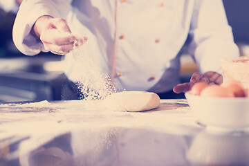 Image showing chef hands preparing dough for pizza