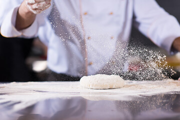 Image showing chef hands preparing dough for pizza