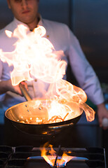 Image showing Chef doing flambe on food