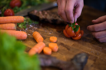 Image showing closeup of Chef hands preparing beef steak