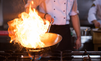 Image showing Chef doing flambe on food