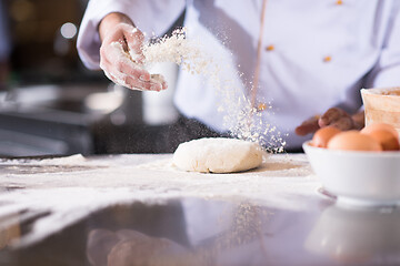 Image showing chef hands preparing dough for pizza