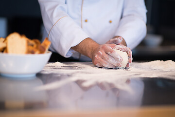 Image showing chef hands preparing dough for pizza