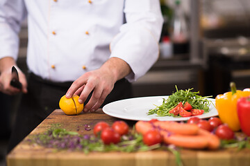 Image showing chef serving vegetable salad