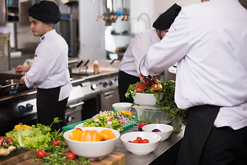 Image showing team cooks and chefs preparing meals