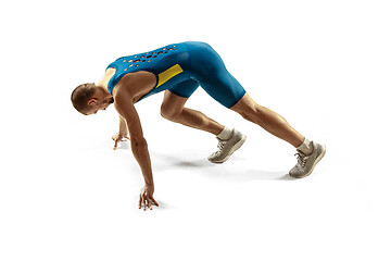 Image showing Young caucasian man running or jogging isolated on white studio background.