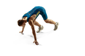 Image showing Young caucasian man running or jogging isolated on white studio background.