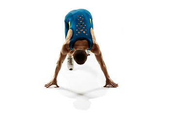 Image showing Young caucasian man running or jogging isolated on white studio background.