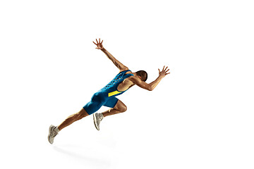 Image showing Young caucasian man running or jogging isolated on white studio background.