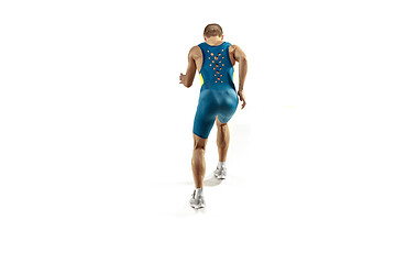 Image showing Young caucasian man running or jogging isolated on white studio background.