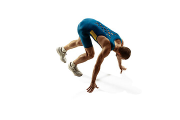 Image showing Young caucasian man running or jogging isolated on white studio background.