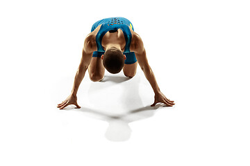 Image showing Young caucasian man running or jogging isolated on white studio background.