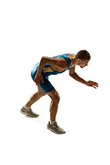 Image showing Young caucasian man running or jogging isolated on white studio background.