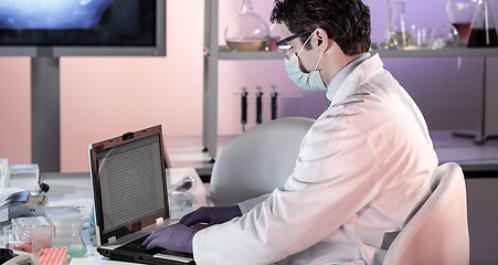 Image showing Scientist working in corona virus vaccine development laboratory research facility.