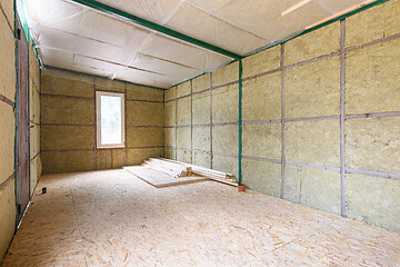 Image showing Construction of a small country house, frame insulated with mineral wool