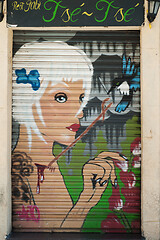 Image showing BARCELONA, SPAIN - JUNE 2, 2013: Portrait of a beautiful young blonde girl painted on the door