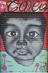 Image showing BARCELONA, SPAIN - JUNE 2, 2013: Portrait of a cute black kid painted on the door