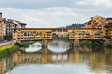 Image showing FLORNCE, ITALY - APRIL 24, 2019: Ponte Vecchio. View of the historic buildings in Florence. Reflection in the river