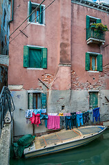 Image showing Typical window and boat near a house in Venice