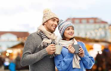 Image showing happy couple drinking coffee at christmas market