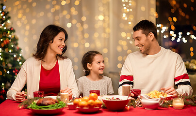 Image showing happy family having christmas dinner at home