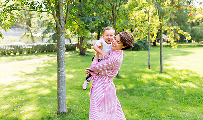 Image showing happy mother with little son in summer park