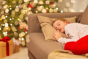 Image showing girl sleeping on sofa at christmas